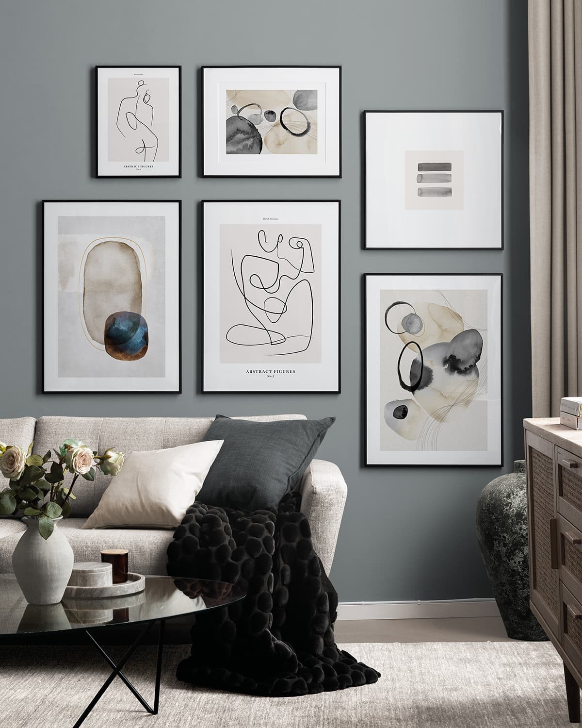 black white and grey gallery wall artworks in living room desenio prints framed on wall