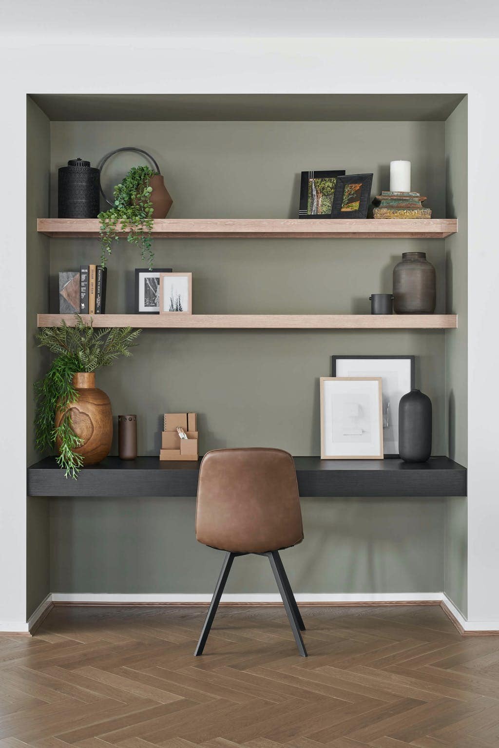 built in home office joinery dark brown timber dark green wall with shelving