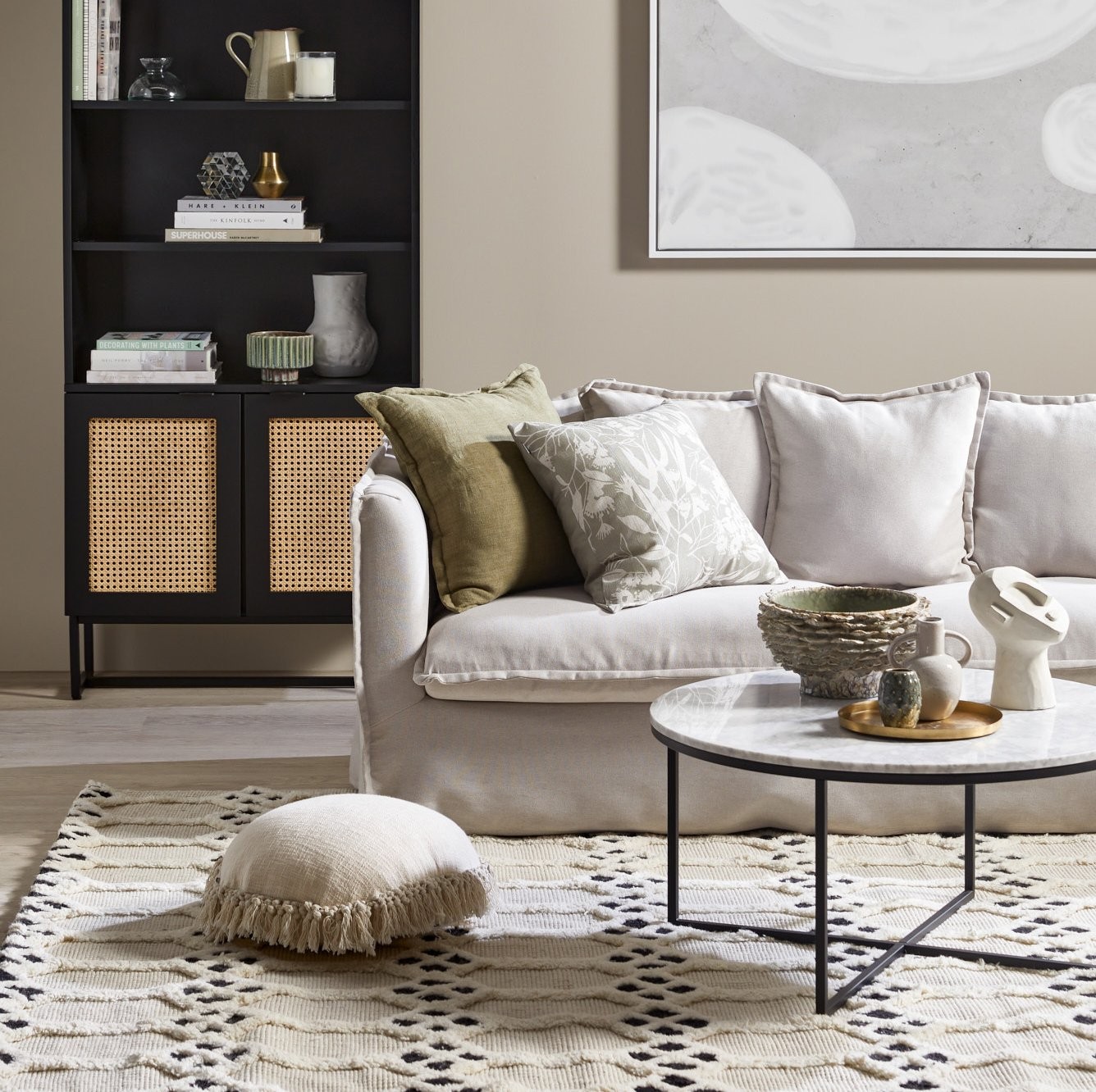 decorating a small living room grey slipcover sofa and black rattan cabinet